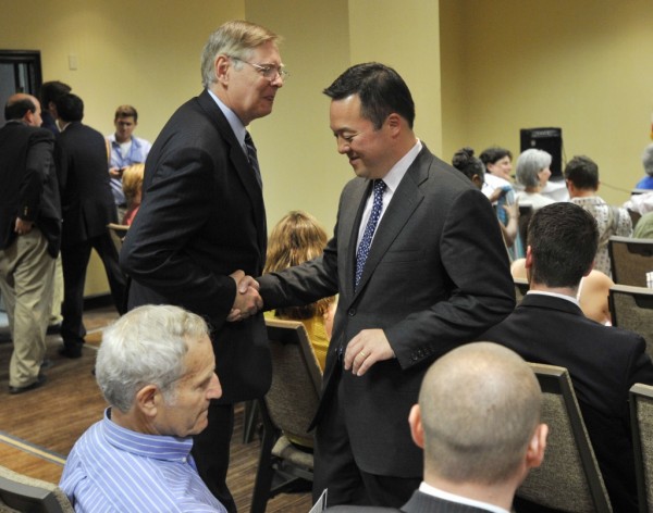 Willilam Tong, right, talks to fellow Democratic mayoral candidate David Martin after Martin accepted the Democratic City Committee endorsement during the committee's meeting at the Sheraton Stamford Hotel on Wednesday, July 18, 2013.