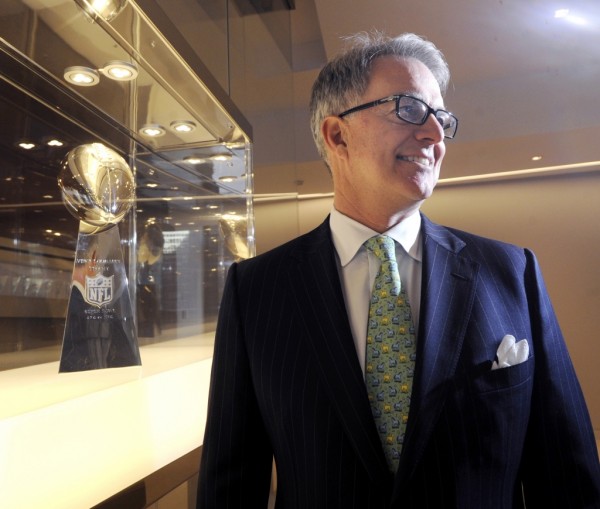  Greenwich resident Paul Hicks III, executive vice president of communications and government affairs for the National Football League, next to the Vince Lombardi Trophy in the NFL offices in New York City, Tuesday afternoon, Jan. 31, 2012. Publication History:  