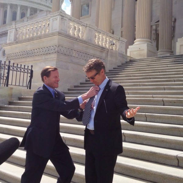 U.S. Sen. Richard Blumenthal, D-Conn., straightens a UConn Huskies tie on his colleague, Sen. Rand Paul, R-Ky. Photo courtesy of Josh Zembik,