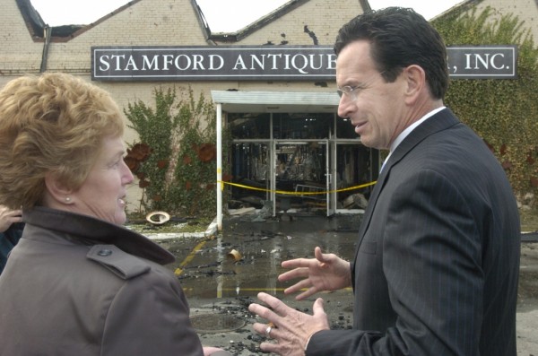 Then-Gov. M. Jodi Rell, left, and then-Stamford Mayor Dannel Malloy discuss a 2006 fire that destroyed numerous businesses in the city's South End.  Andrew Sullivan/Staff photo