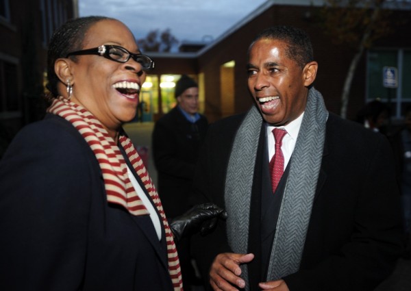 State treasurer Denise Nappier, left, laughs with Stratford Democratic mayoral candidate Joe Paul outside Nichols School in Stratford, Conn., on Tuesday, November 5, 2013.