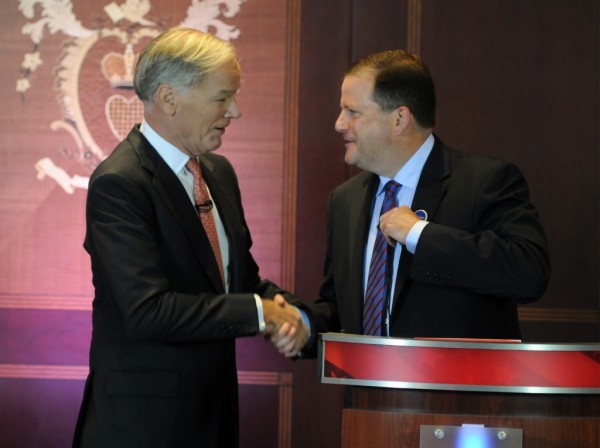 Republican gubernatorial candidates Tom Foley, left, andJohn McKinney shake hand at the conclusion of a debate held at the Hartford Courant building Thursday, July 17, 2014, for the two Republicans running for governor in Connecticut. Foley, is a businessman from Greenwich and former U.S. ambassador to Ireland. McKinney, of Fairfield, is the Senate minority leader in Connecticut. (AP Photo/Hartford Courant, Brad Horrigan, Pool)