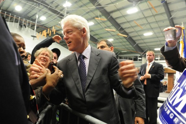 Former President Bill Clinton chats with supporters at a rally for Congressman Jim Himes at SoNo Field House in Norwalk, Conn., Sunday, October 31, 2010. Clinton was a featured speaker during the rally where Democratic candidates Dan Malloy and Richard Blumenthal also were on hand.
