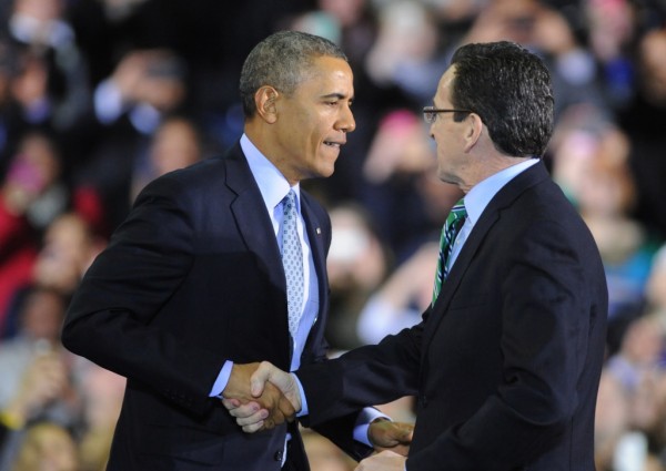President Barack Obama shakes hands with Connecticut Governor Dannel P. Malloy before speaking at Kaiser Hall Gymnasium on the campus of Central Connecticut State University in New Britain, Conn. Wednesday, March 5, 2014.  President Obama discussed his support to raise the minimum wage to $10.10 and was joined by Vermont Governor Peter Shumlin, Rhode Island Governor Lincoln Chafee, Massachusetts Governor Deval Patrick and Connecticut Governor Dannel P. Malloy.