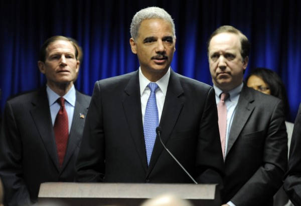 U.S. Attorney General Eric Holder, center speaks at a news conference to announce a new effort to reduce gun violence in the state's major cities, as U.S. Sen. Richard Blumenthal, D-Conn., left, and U.S. Attorney David Fein, right, look on, in New Haven, Conn., Tuesday, Nov. 27, 2012.  (AP Photo/Jessica Hill)