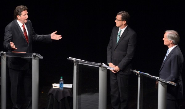 Connecticut Gubernatorial candidates, from left, Independent Joe Visconti, Gov. Dannel Malloy, and Republican Tom Foley actively discuss multiple topics during the gubernatorial debate at the Garde Arts Center in New London, Conn., Thursday Oct. 16, 2014.(AP Photo/The Day, Tim Cook)