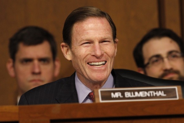 Sen. Richard Blumenthal, D-Conn., smiles as he speaks to attorney general nominee Loretta Lynch on Capitol Hill in Washington, Wednesday, Jan. 28, 2015, before the Senate Judiciary Committee's confirmation hearing. If confirmed, Lynch would replace Attorney General Eric Holder, who announced his resignation in September after leading the Justice Department for six years. She is now the U.S. Attorney for the Eastern District of New York. This is the first nomination hearing under the new Republican majority. (AP Photo/Jacquelyn Martin)