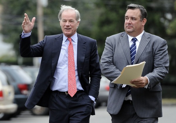 Republican Tom Foley, left, walks with campaign manager Justin Clark, right, to a news conference to announce a committee to explore his prospects for the 2014 Connecticut governor's race in Bridgeport, Conn., Tuesday, Sept. 10, 2013.  (AP Photo/Jessica Hill)