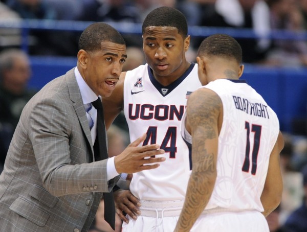 UConn head coach Kevin Ollie speaks to guards Rodney Purvis (44) and Ryan Boatright (11) on Thursday, March 12, 2015, at XL Center in Hartford, Conn. (Brad Horrigan/Hartford Courant/TNS)