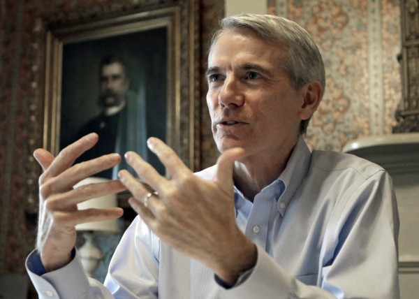  In this Monday, Oct. 13, 2014 file photo, Sen. Rob Portman, R-Ohio, speaks during an interview in Lebanon, Ohio. National environmental group the National Resources Defense Council has launched a $500,000 ad campaign against Portman in Ohio, claiming a federal budget amendment he introduced could undercut the enforceability of the federal Clean Air Act. (AP Photo/Al Behrman, File)