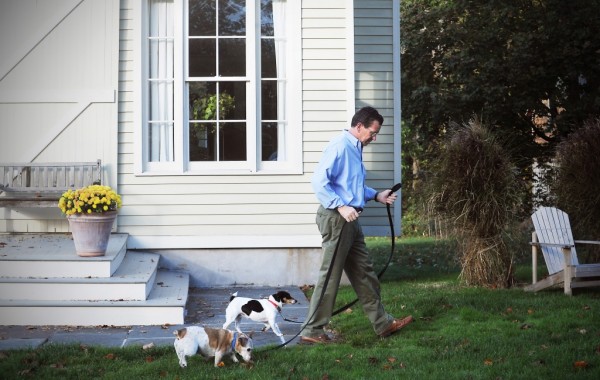 Dannel P. Malloy, seen in this 2010 file photo when he was the governor-elect, walks his Jack Russell terriers, Puck, foreground, and Zoe outside his then-Stamford home. 